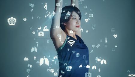 Woman holding her airs in the air while different health icons appear in front of her