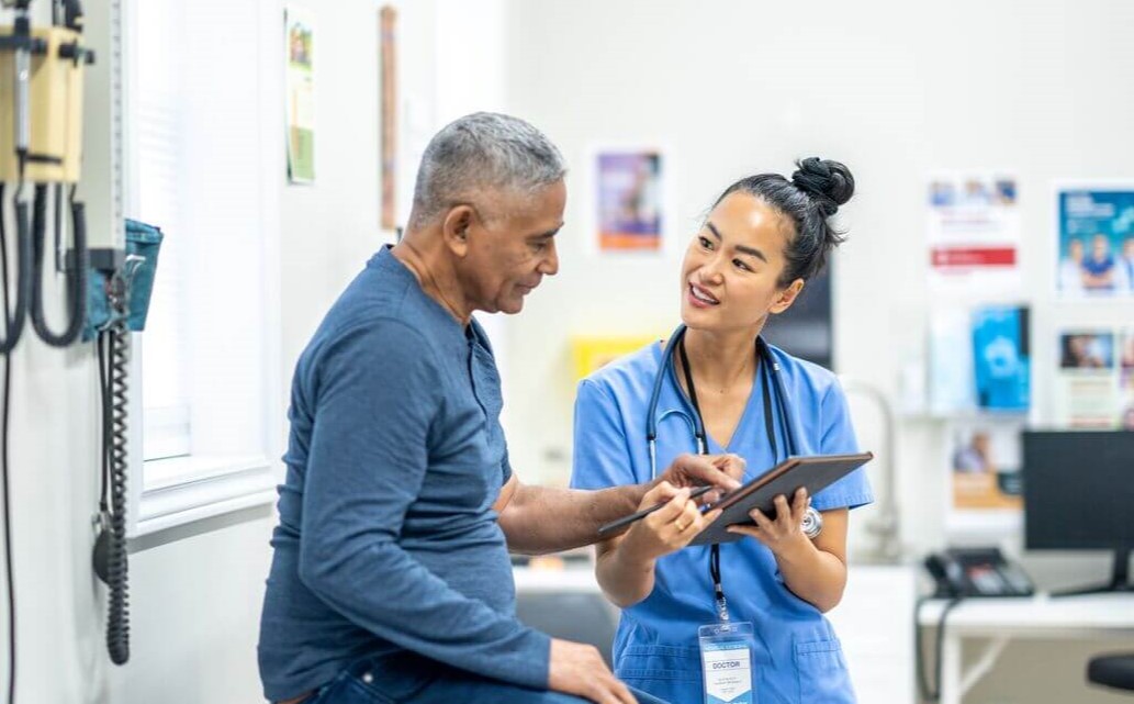 A patient and a doctor reviewing results.
